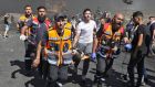 Palestinian paramedics evacuate a wounded protester amid clashes with Israeli security forces near the settlement of Beit El and Ramallah in the occupied West Bank. Photograph: Abbas Momani/AFP via Getty Images