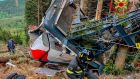 Rescuers work at the wreckage of a cable car that collapsed near the summit of the Stresa-Mottarone line in the Piedmont region of northern Italy. Photograph: Italian Vigili del Fuoco Firefighters via AP