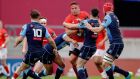 Munster’s CJ Stander is tackled by Ben Thomas and Tomos Williams of Cardiff Blues during the Guinness Pro 14 Rainbow Cup game at  Thomond Park. Photograph: Bryan Keane/Inpho