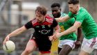 Down’s Corey Quinn in action against  Boidu Sayeh and James Dolan of Westmeath at TEG Cusack Park, Mullingar. Photograph: Bryan Keane/Inpho 
