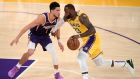 LeBron James in action against Devin Booker who amassed 47 points at the Staples Center. Photograph: Harry How/Getty Images