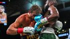  Former world welterweight champion  Floyd Mayweather lands an uppercut to the face of YouTube personality Logan Paul during their  eight-round exhibition bout at Hard Rock Stadium in Miami, Florida on Sunday night. Photograph:  Chandan Khanna/AFP via Getty Images