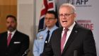 Australian prime minister Scott Morrison: ‘This is a watershed moment in Australian law enforcement history.’ Photograph: Dean Lewins/EPA