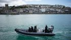 Police patrol the waters at St Ives harbour, Cornwall, ahead of Friday’s G7 summit. Photograph: Aaron Chown/PA Wire 