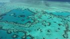 Aerial view from November 2014 of the Great Barrier Reef off the coast of the Whitsunday Islands, along the central coast of Queensland. Photograph:  SARAH LAI/AFP via Getty Images