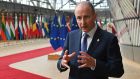Taoiseach Micheal Martin addresses the media  as he arrives on the first day of a European Union (EU) summit at the European Council Building in Brussels, Belgium. Photograph: John Thys/EPA/Pool