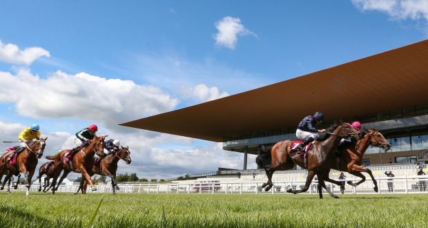 Thundering Nights ridden by jockey Shane Crosse (right) wins the Alwasmiyah Pretty Polly Stakes from Ryan Moore on Santa Barbara at the Curragh. Photograph:  Lorraine O’Sullivan/PA Wire