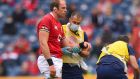 Former Lions captain Alun Wyn Jones is led from the field by medics after suffering the injury against Japan which rules him out of the tour to South Africa. Photograph: Stu Forster/Getty Images