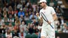 Andy Murray in action against Nikoloz Basilashvili on Centre Court on day one of Wimbledon. Photograph: John Walton/PA Wire. 