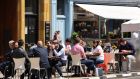 People dining outdoors on Dublin’s Baggot Street on Wednesday. Photograph: Dara Mac Dónaill/The Irish Times