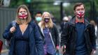 Tennis fans wearing face masks during the Wimbledon championships in London. Photograph:   Aeltc-Pool/Getty Images