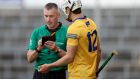 Referee James Owens prepares to show Clare’s Aidan McCarthy a yellow card during the Munster semi-final in  Limerick. Owens will tell the meeting of his colleagues what he saw at the time and what guided his action. Photograph: Bryan Keane/Inpho 