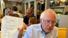 Bernie Sanders holds a note at Henry’s Diner in Burlington, Vermont, during his interview with Maureen Dowd last Monday. Photograph: Shawn McCreesh/New York Times