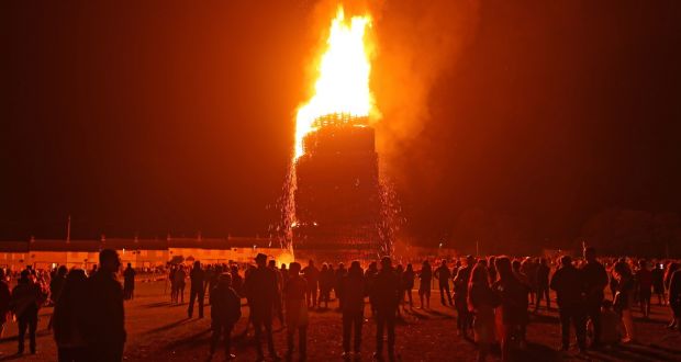 The huge bonfire in Craigyhill, Larne, is lit on the ‘Eleventh night’ to usher in the Twelfth of July commemorations. Photograph: Niall Carson/PA Wire 