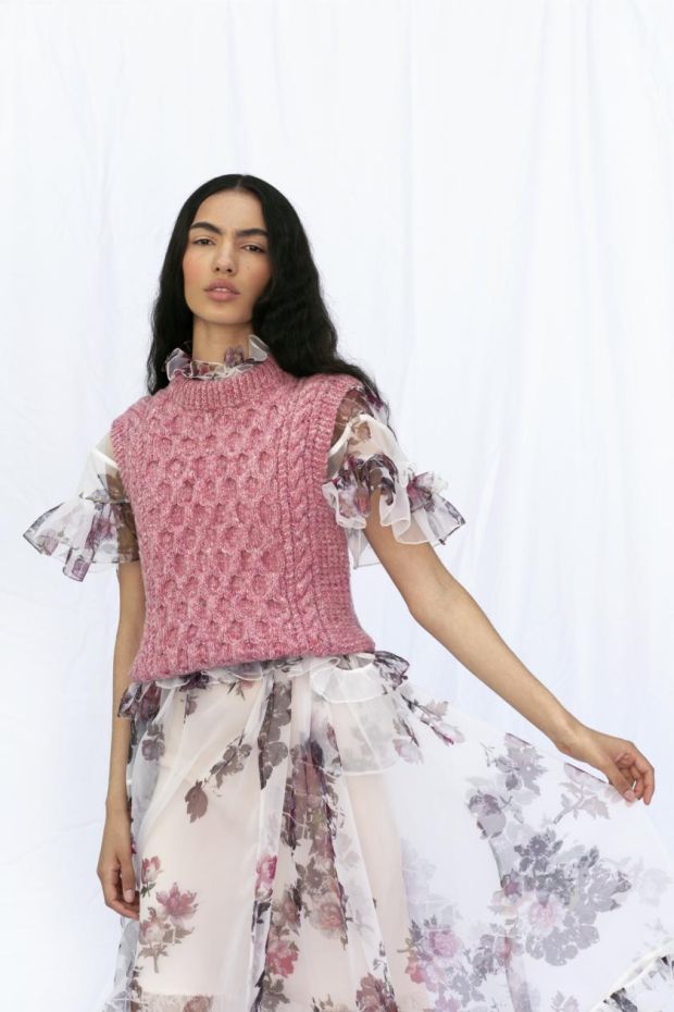 Sleeveless pink sweater (€495) from Faye Dinsmore, ruffled dress (€1,050) from Preen at Costume