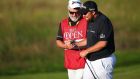  Shane Lowry  and his caddie Bo Martin on the 18th green after the second round of the 149th Open Championship at Royal St George’s. Photograph:  Christopher Lee/Getty Images