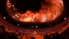  Volunteers and athletes watch a fireworks display at the end of the opening ceremony of the Tokyo 2020 Olympic Games at the Olympic Stadium in Tokyo. Photograph:  Andrej Isakovic/AFP via Getty Images