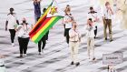  Flag bearers Donata Katai and Peter Purcell-Gilpin of Team Zimbabwe during the opening ceremony of the Tokyo  Olympic Games. Photograph: Patrick Smith/Getty Images