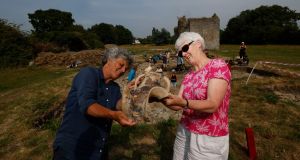 Geraldine Stout, co-director of Beaubec Excavations, and Rosanne Meenan, finds assistant, examining a 13th century fuming pot  found on the medieval farm  near Drogheda. Photograph: Alan Betson / The Irish Times