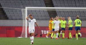 Christen Press looks dejected following the USA’s defeat to Sweden in Tokyo. Photograph: Dan Mullan/Getty