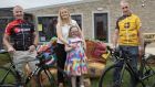 Catherine Cleary, chairperson of the Tipperary branch of Down Syndrome Ireland, with her daughter Katie at Meitheal 21 in Thurles, flanked by Tour de Munster founder Paul Sheridan and former professional cyclist Seán Kelly,