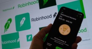 Robinhood receives an average of 2.5 cents for every $100 traded; the more clients trade, the more money it makes. Photograph:   Chris Delmas/AFP via Getty Images