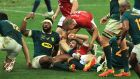 South Africa captain Siya Kolisi celebrates after tackling Robbie Henshaw to prevent a Lions try. Photograph: David Rogers/Getty Images