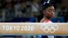 Simone Biles prepares to start her performance on the balance beam during the  Olympics. “My mental and physical headlth is better than any medal.” Photograph: Gregory Bull/AP )