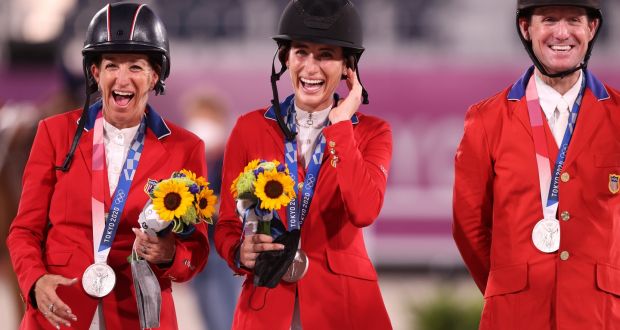  Laura Kraut, Jessica Springsteen and McLain Ward celebrate winning silver for the USA in the show jumping  team final in Tokyo. Photograph: Julian Finney/Getty Images