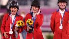  Laura Kraut, Jessica Springsteen and McLain Ward celebrate winning silver for the USA in the show jumping  team final in Tokyo. Photograph: Julian Finney/Getty Images