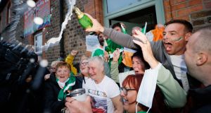 Yvonne Harrington, mother of Olympic Boxing Gold Medal Winner Kellie Harrington, celebrates her Tokyo Olympic Gold medal win in the street outside their home on Portland Row in Dublin. Photograph: Alan Betson