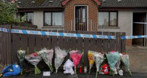 Flowers and teddy bears are left at a house in Dungannon, where  the toddler – named locally as Ali Jayden Maguire – was found. Photograph: Press Eye