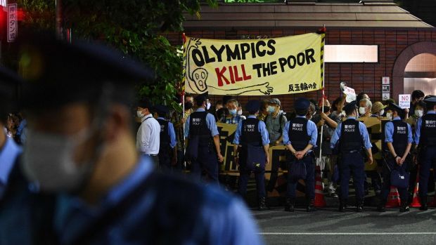 Demonstrators protest against the Olympics outside the closing ceremony. Photo: Philip Fong/AFP via Getty Images