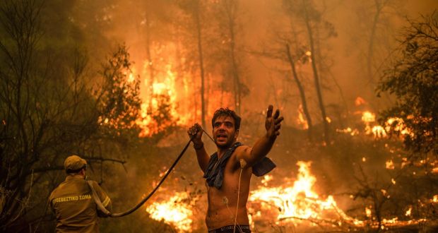  A local resident joins the attempt to fight  wildfires  approaching the village of Pefki on Evia (Euboea) island, Greece’s second largest island. We have been gently boiling our planet and the evidence is all around us.  Photograph: Angelos Tzortzinis/AFP/Getty Images 