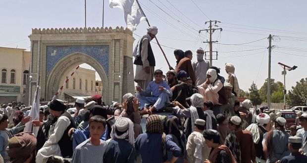 Taliban fighters stand on a vehicle along the roadside in Kandahar on Friday.  Photograph: AFP via Getty Images