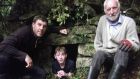 Farmer Michael McPartland (right) with his son Rory and his grandson Paddy (12) at a sweathouse on their family farm at Cornageeha, Co Leitrim. Photograph: Donald McCarthy