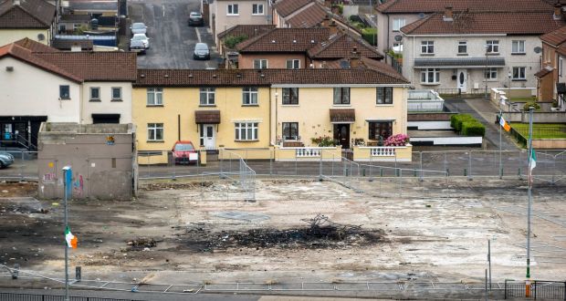 Scorched ground on Meenan Square in the Bogside area of Derry City after the burning of a bonfire with banners making threats towards police officers and a member of the public. Photograph: Liam McBurney/PA