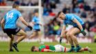 Mayo’s Eoghan McLaughlin lies on the ground after a challenge  from Dublin’s John Small during the All-Ireland semi-final at Croke Park. Photograph: Tommy Dickson/Inpho