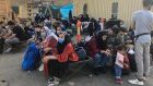 People wait to be evacuated from Afghanistan at the airport in Kabul on Wednesday. Photograph: AFP via Getty Images