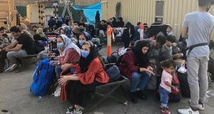 People wait to be evacuated from Afghanistan at the airport in Kabul on Wednesday. Photograph: AFP via Getty Images