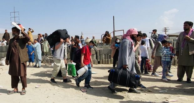 People seeking to leave Afghanostan gather outside the Hamid Karzai International Airport  in Kabul on Thursday. Photograph: EPA