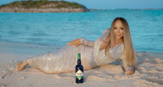 Mariah Carey promoting her cream liqueur brand,   Black Irish, which is a tribute to her Cork heritage
