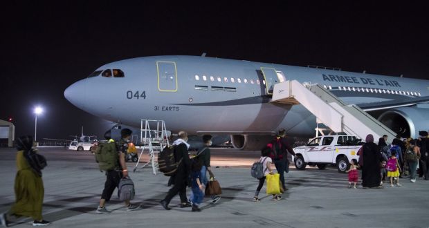 French and Afghan citizens being evacuated to France in a French military plane, at Abu Dhabi airport. Photograph: Etat Major des Armees via AP