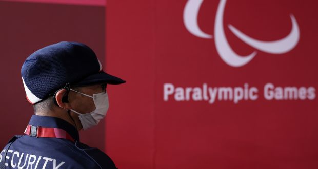 A masked security guard at the Paralympic Games  in Chiba, Japan. Photograph:  Lintao Zhang/Getty Images