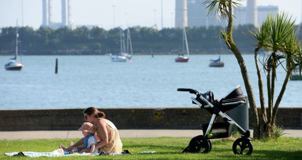 A woman and child enjoying the sun on Clontarf promenade in Dublin on Tuesday. Photograph: Caroline Quinn/PA Wire 