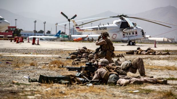 A handout image from the US Marine Corps shows marines providing security at Hamid Karzai International Airport in Kabul, Afghanistan. Photograph: AP
