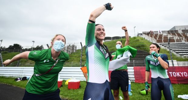 Ireland’s Eve McCrystal, centre, and Katie-George Dunlevy, right, celebrate with team doctor Katie Lydon and coach David Greene after winning gold in the Women’s B Time Trial at the Fuji International Speedway during the Tokyo 2020 Paralympic Games in Japan. Photograph:  David Fitzgerald/Sportsfile 