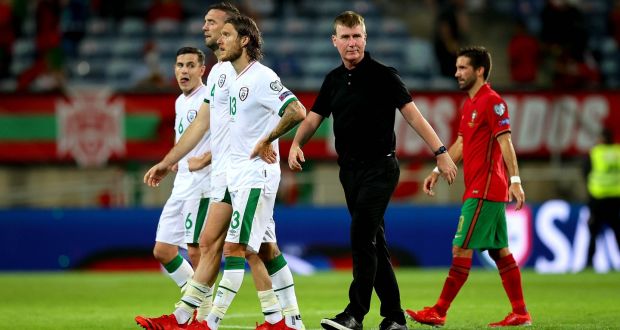 Stephen Kenny walks off the pitch with some of his Ireland players after the loss to Portugal at the Estadio Algarve. Photograph: Ryan Byrne/Inpho