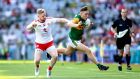Frank Burns put in an early hit on Dara moynihan to set the tone for Tyrone against Kerry. Photograph: Ryan Byrne/Inpho