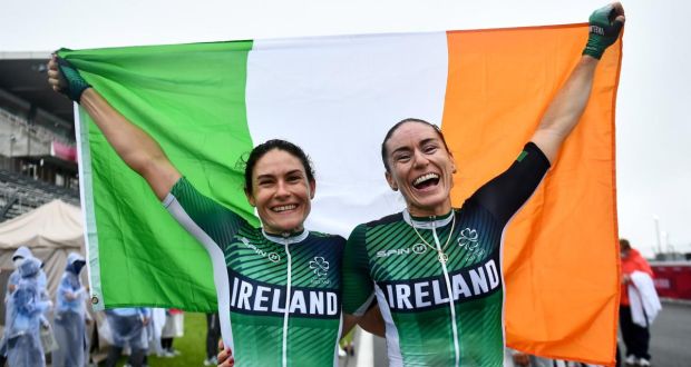 Katie George Dunlevy and Eve McCrystal celebrate after securing their second gold medal of the Tokyo Paralympics, in the B road race. Photograph: David Fitzgerald/Sportsfile